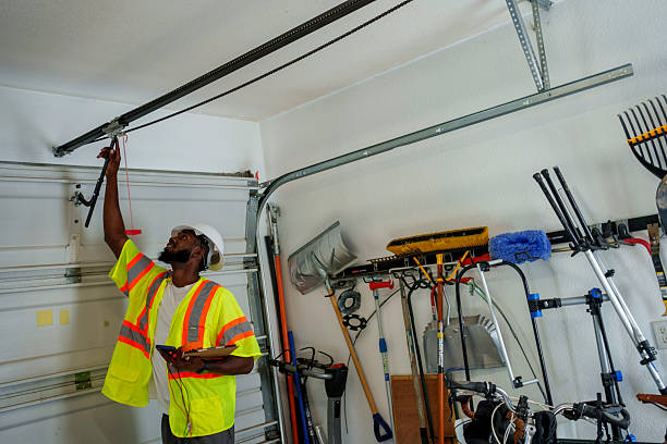 Professional Garage Door Panel Replacement technician working in Española, NM